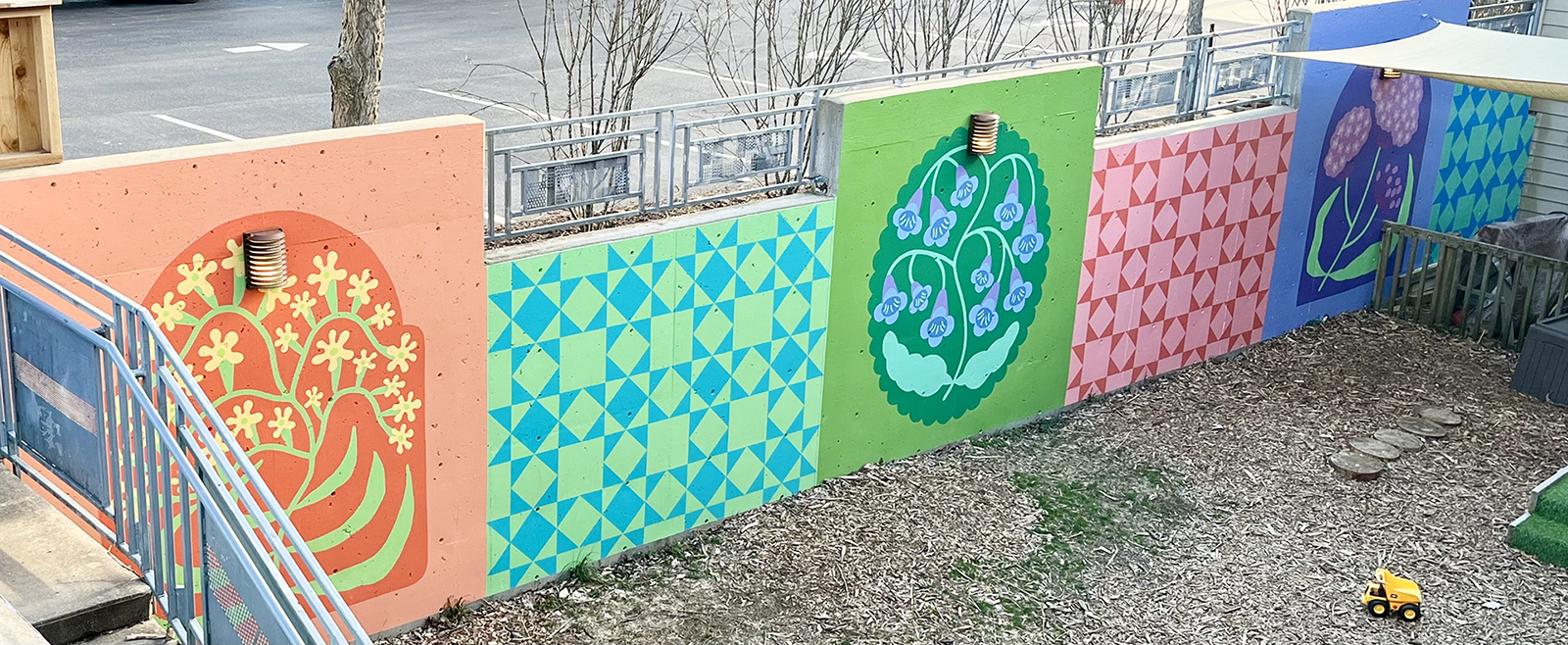 A campus wall painted with flower murals